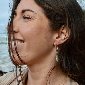 Radiant Silver Feather Earrings
