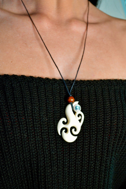 Hand Carved Tribal pendant.